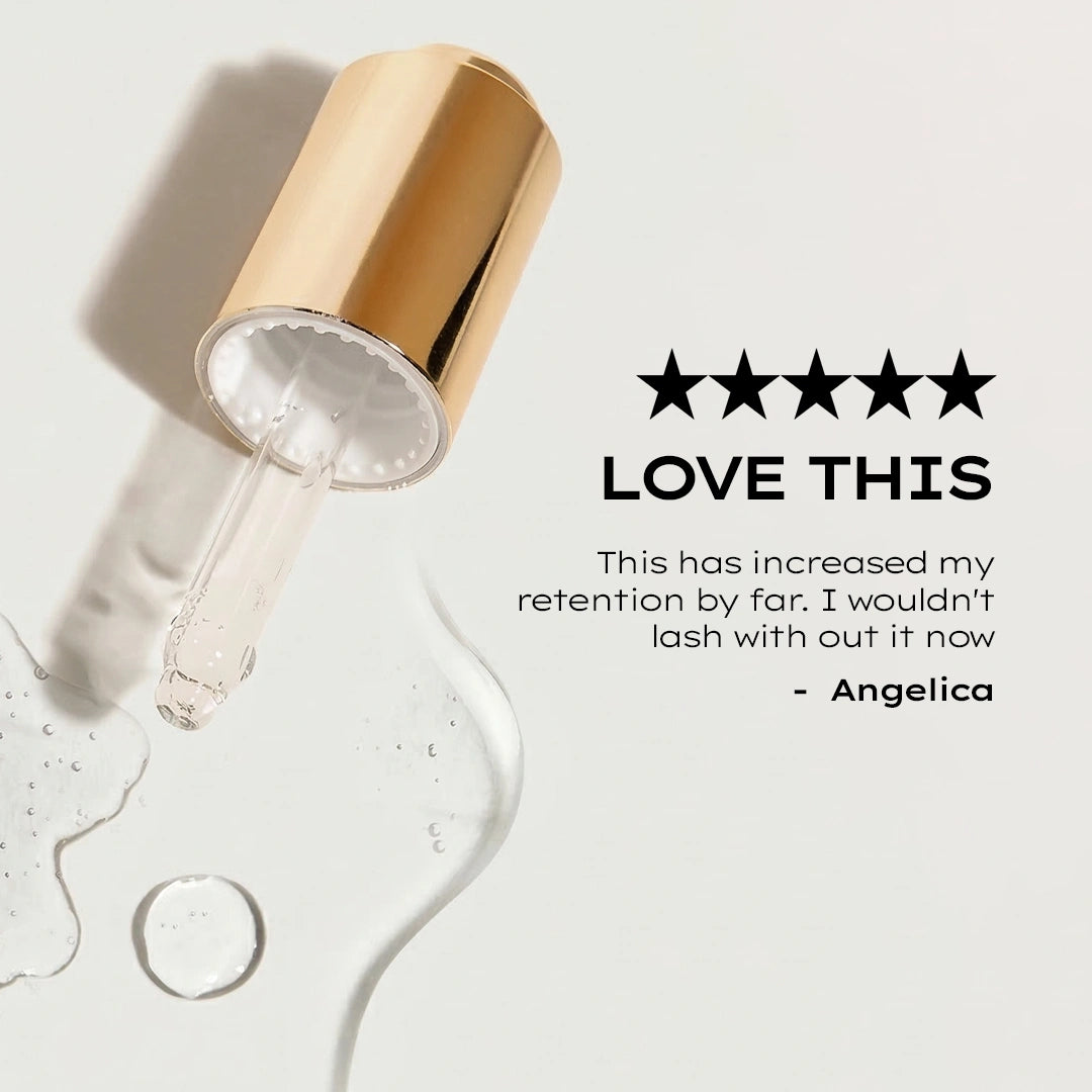 Gold eyelash serum applicator with five-star rating and customer review on a light background