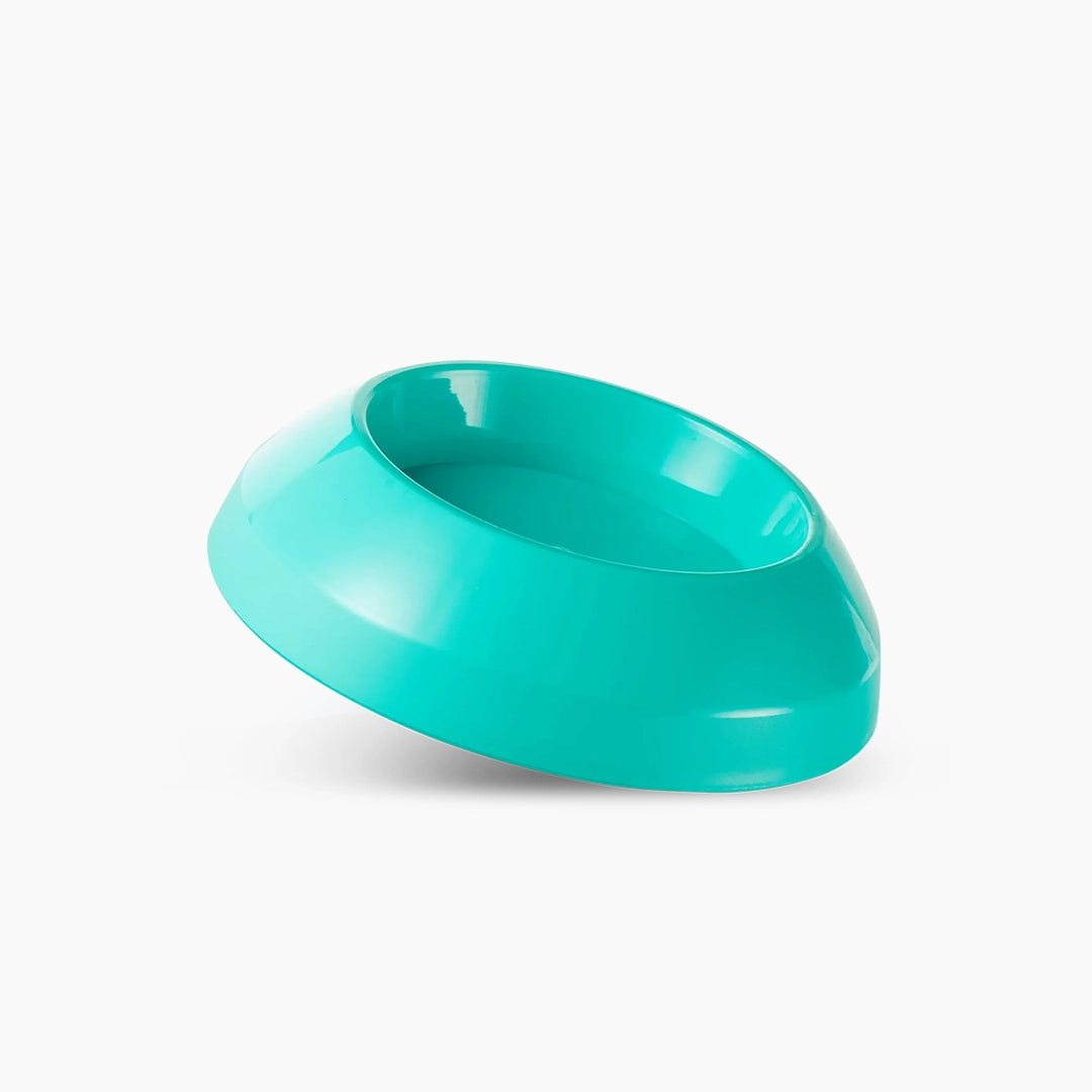 Turquoise plastic bowl on a white background